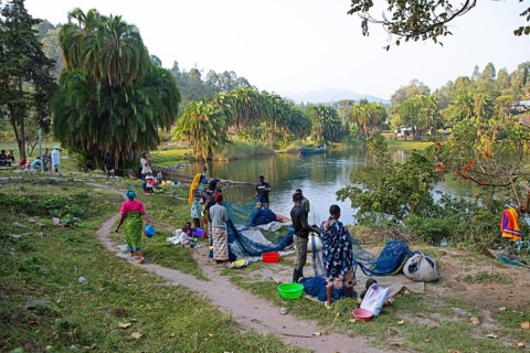 Rwandan men and woman free fishing nets from fish on the shores of Lake Kivu or Lake Kivu, Kibuye