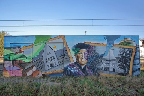 Mural with memorial to Rector and Professor August Reatz of the University, history, head, books,