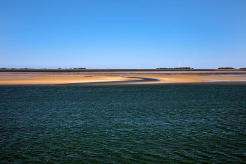 Schleswig-Holstein Wadden Sea National Park at low tide with sandbanks and mainland, North Frisia,