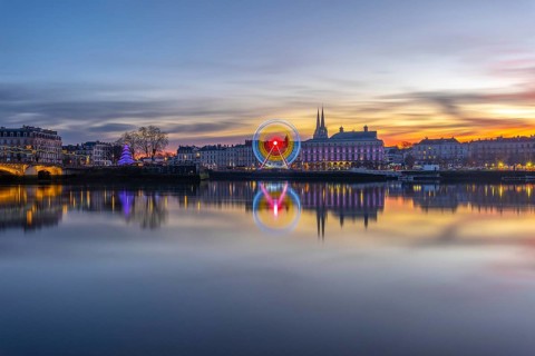 Bayonne, france, on christmas night experiencing a beautiful sunset reflecting upon the adour