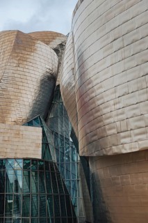 Exterior view of the Guggenheim Museum with titanium plates and glass elements in Bilbao, Spain