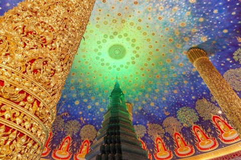 In the emerald green silence of Wat Paknam Phasi Charoen, the glass chedi rises like a glowing