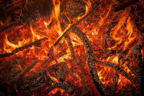 Fiery embers with blazing flames and burnt wood, fire, Finland