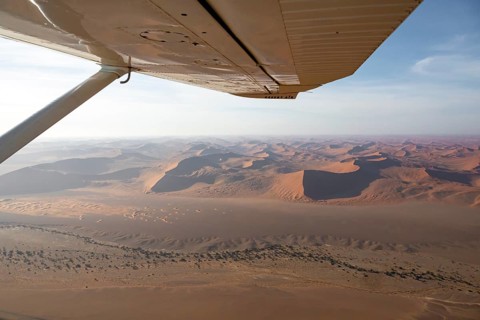 Aerial view from the plane, red sand dunes of the Namib Desert, Namib Naukluft Park, Namibia