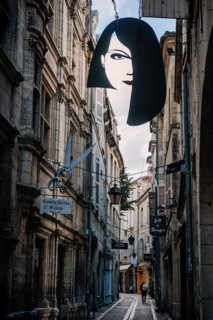 Guild sign of a hairdressing salon in the old town of Pèrigueux, Dordogne, France