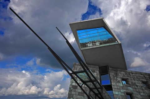 Modern entrance to the Reichsparteitagsgelände documentation center against cloudy skies, former