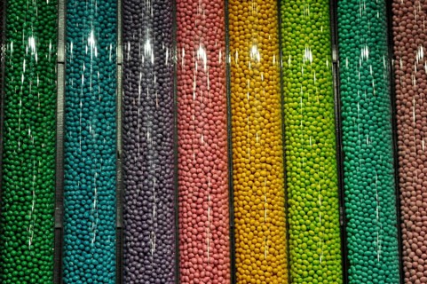 Close-up of colorful candy M&M's in even vertical rows, Las Vegas, Nevada, USA