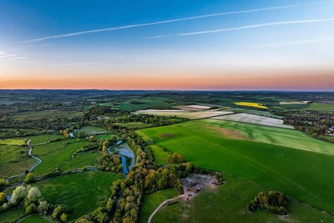Sunset of Fields and Farms over Horsebridge nad Stockbridge from a drone, Hampshire, England,