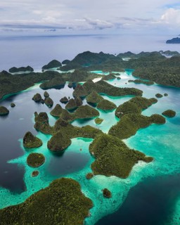 Aerial view of tropical islands and turquoise lagoons, Wayag Archipelagio, West Papua, Indonesia