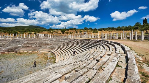Ancient stadium, with rows of stone seats and remaining columns, Messene Stadium, Ancient Site,