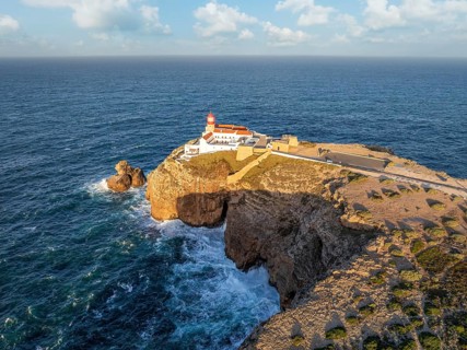 Drone view of the Lighthouse of Cabo de Sao Vicente in Sagres, Algarve, Portugal, at sunrise with