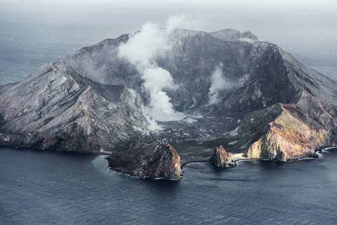 Aerial view of the steaming volcanic crater of Whakaari, White Island, New Zealand
