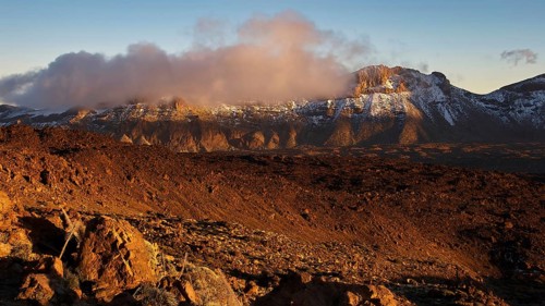 Mirador El Tabonal Negro, FMountains in the evening light with clouds above the peaks creating a