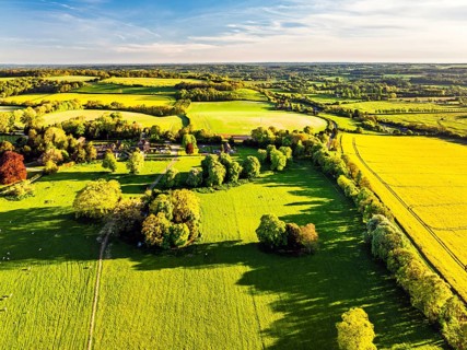 Fields and Farms over Horsebridge nad Stockbridge from a drone, Hampshire, England, United Kingdom