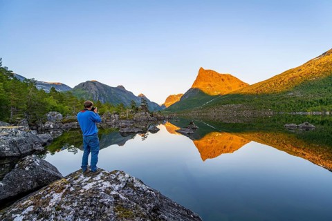 Young man photographed, picturesque mountain landscape in the Innerdalen high valley with