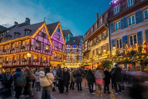 Colourfully illuminated and Christmassy decorated half-timbered houses, old town, blue hour,