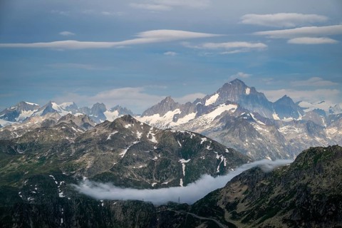 Mountain landscape with clouds of fog, Valais, Switzerland