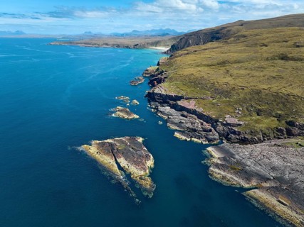 Aerial photo of the red cliffs at Rua Reidh Point, Gairloch, Scotland, UK