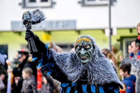 Member of a fools' guild in traditional Haes, fools' clothes, during the carnival procession in