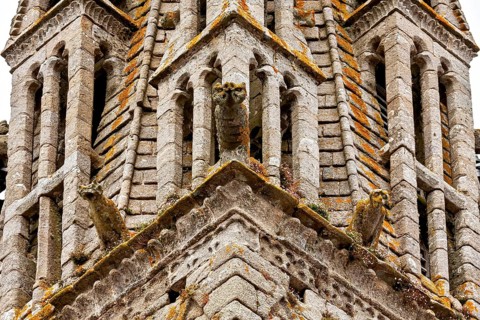 Gothic church tower with detailed stone figures and decorations, Saint-Paul-Aurélien Cathedral in
