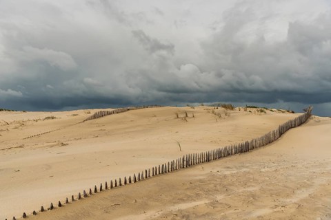 Emerging storm in sunshine in the dunes on the Atlantic coast, Soulac-sur-Mer, France