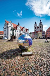 Market square with town hall, city church, town and parish church of St. Marien and globe with QR