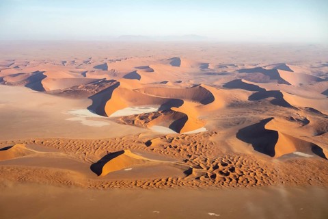 Aerial view of salt pans and red sand dunes of the Namib Desert, Namib Naukluft Park, Namibia