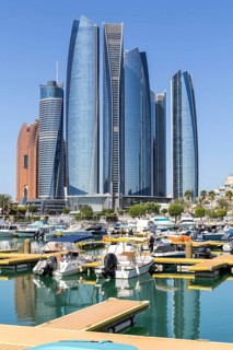 Abu Dhabi Skyline Etihad Towers skyscrapers with marina yacht harbor in Abu Dhabi, United Arab