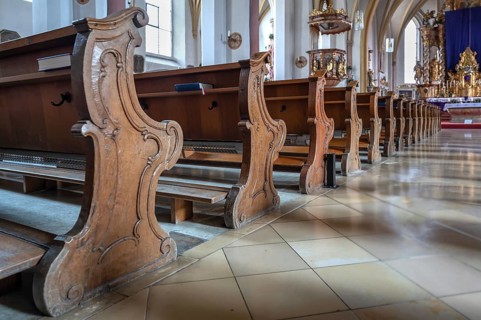 Carved cheeks of pews in the parish church of the Most Holy Trinity, founded in 1364, Kösslarn,