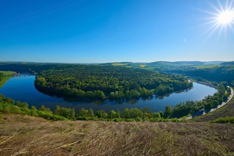 Brilliant sun over an idyllic bend in the river Mainschleife, Urphar, Wertheim, Main Tauber Kreis,