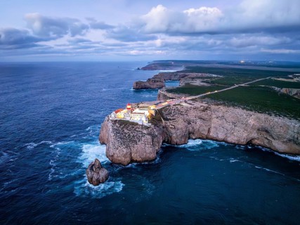 Drone view of the Lighthouse of Cabo de Sao Vicente in Sagres, Algarve, Portugal, at evening with