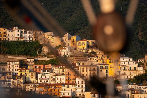 Talje or pulley of a sailing ship, blurred in front of old town Scilla, Strait of Messina,