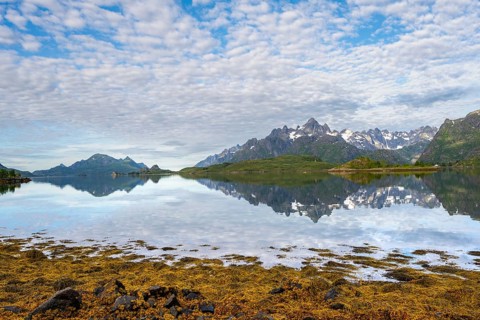 Picturesque fjord landscape at Raftsund fjord, mountains reflected in water, Vesterålen, Norway