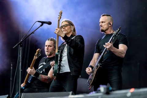 Bass player Brian Marshall (left) singer Myles Kennedy (centre) and guitarist Mark Tremonti (right)