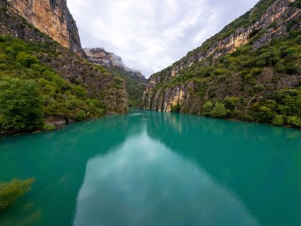 Entremon gorge on the cinca river features turquoise water flowing through a deep canyon, with