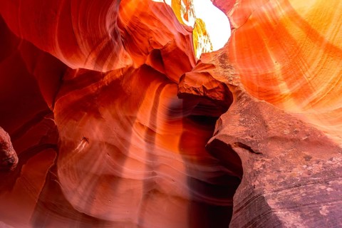 Antelope canyon slot canyon forming unique swirling sandstone wall textures creating vibrant