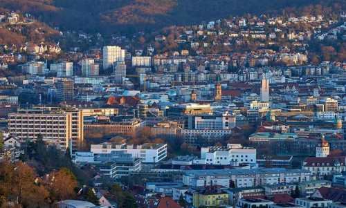 Panoramic view of Stuttgart city center in Germany during spring with warm golden evening light.