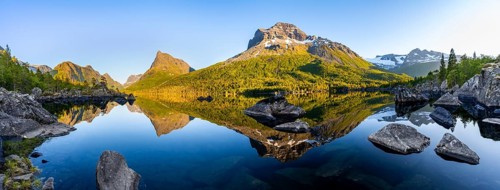 Panorama, picturesque mountain landscape with Innerdalstårnet peak in the Innerdalen high valley,