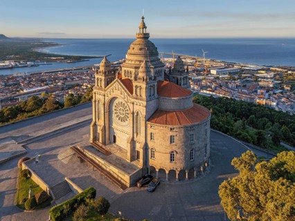 Aerial close view of Santa Luzia sanctuary in Viana do Castelo at sunrise, highlighting the ornate