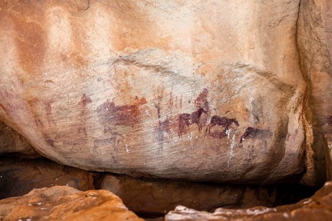 Prehistoric animal depictions, ancient rock carving of the San, indigenous people of South Africa,