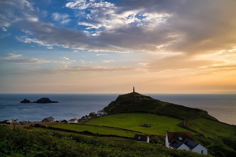 Chimney of a former mine, tin mine, copper mine, in memory of mining, Cape Cape Cornwall, behind