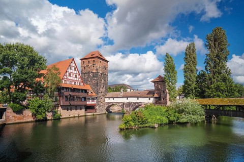 Wide angle view of the medieval riverside architecture in Nuremberg, featuring the Hangman's bridge