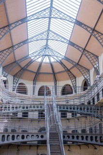 View of the glass roof of a historic building with metallic structures inside, Kilmainham Gaol