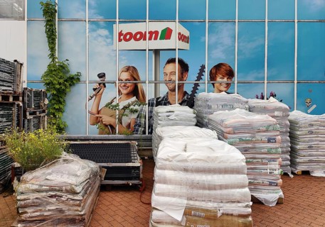 Goods for sale in front of an advertising photo at Toom Baumarkt, Witten, Ruhr region, North