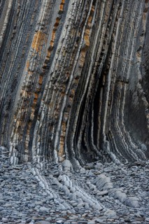 Geological formation of sandstone and limestone layers, Flysch on Itzurun Beach in Zumaia, Spain