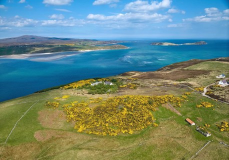 Aerial photo of a bay with golden sand beach at the scottish atlantic coast near Coldbackie,