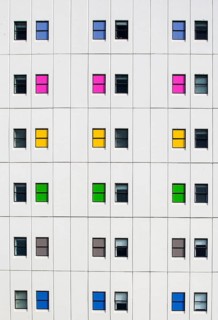Colourful windows patterning a modern apartment facade, Christchurch, New Zealand