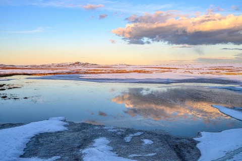 Storsjö Kapell, Jämtlands län, Sweden, snowy and icy landscape with water areas reflecting the sky