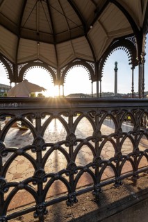 24.4.2026: The ornate cast iron music pavilion on Schlossplatz at sunrise. Sun star effect through