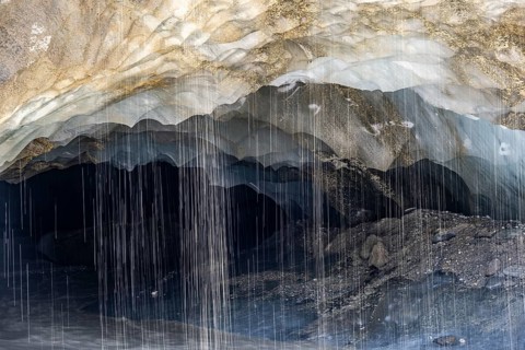 Meltwater at a glacier cave, underground glacier stream, Castner Glacier, Delta Range, Alaska